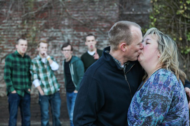 Courtesy of Oberst family
Steve Oberst of Battle Ground, who is fighting prostate cancer, kisses his wife, Susan. Family and friends have held fundraisers to help pay his medical bills as he receives out-of-state treatment. The couple's four sons are in the background.