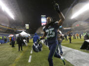 Seattle Seahawks Richard Sherman runs off the field after the Seahawks beat the San Francisco 49ers 42-13 in an NFL football game, Sunday, Dec. 23, 2012, in Seattle.