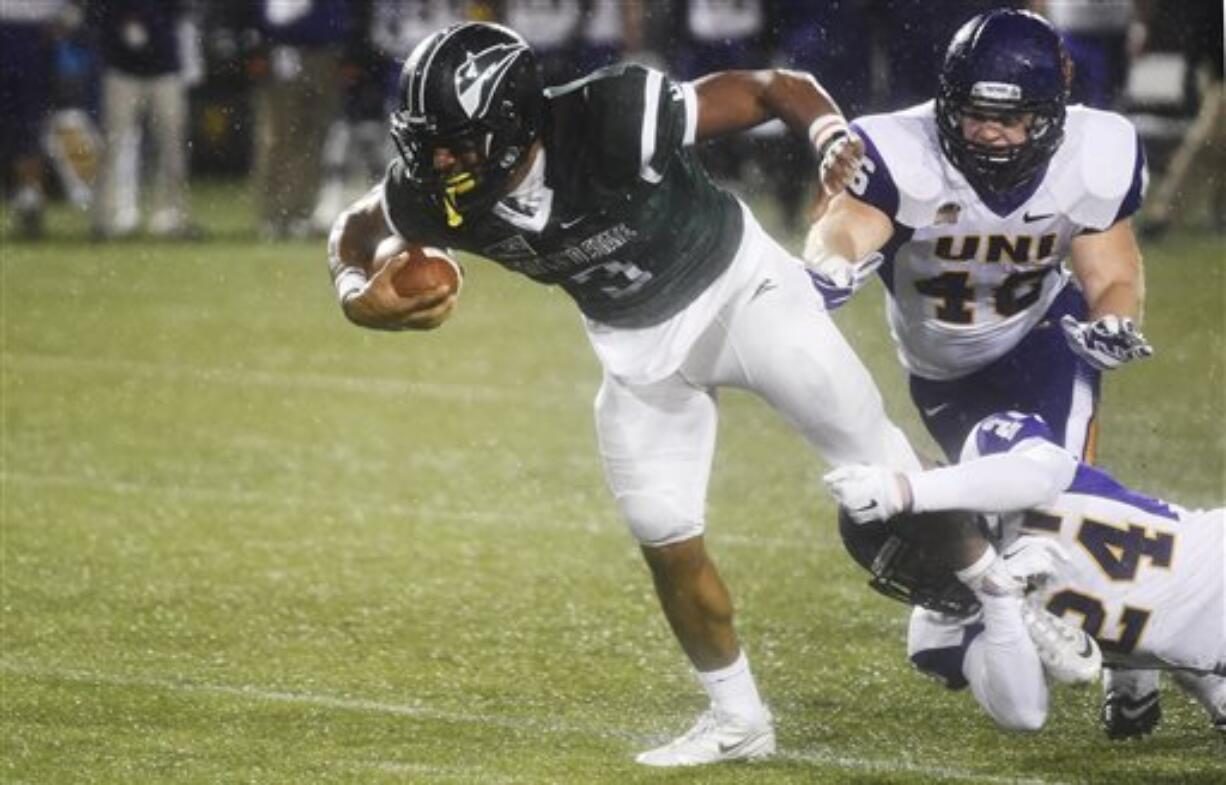 Portland State running back David Jones (3) is brought down by Northern Iowa defensive back Tim Kilfoy (24) and linebacker Jared Farley (46) during the first half of a second-round NCAA FCS playoff game at Providence Park on Saturday, Dec. 5, 2015, in Portland, Ore.