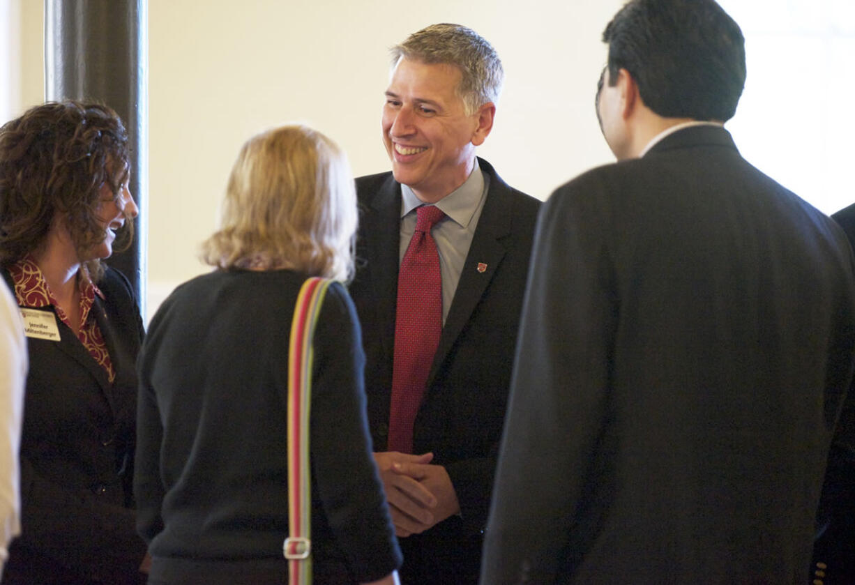 Washington State University Vancouver's new chancellor, Mel Netzhammer, received an enthusiastic welcome during a ceremony on Thursday.