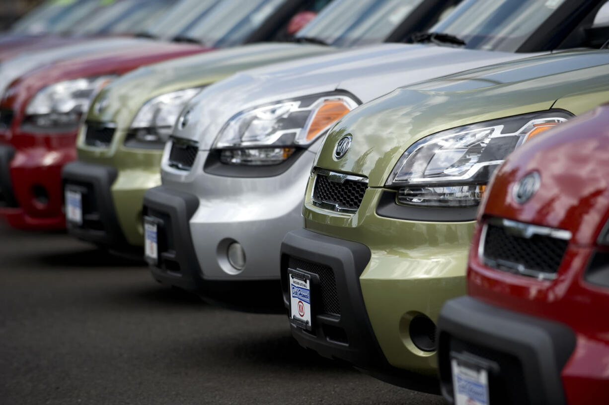 Clark County's third-quarter retail sales were improved by a surge of car buyers trading old makes for new models, such as these Kia Souls at Dick Hannah Kia in Vancouver.