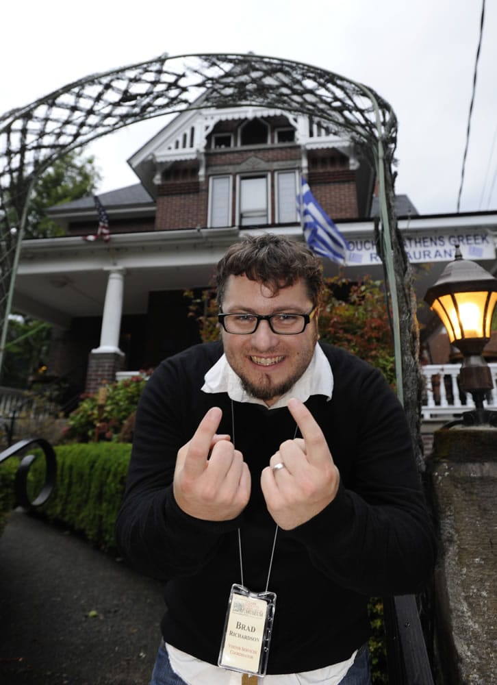 Brad Richardson of the Clark County Historical Museum welcomes visitors to Hidden House, now a Greek restaurant, where some have reported hearing mysterious singing, doors locking by themselves and other strange occurrences.