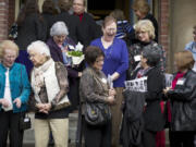 The whole group gathers for a photo on the front steps of The Academy; afterward there was lots of laughter and catching up.