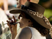 A woman sips wine on the opening night of the 2011 Vancouver Wine and Jazz Festival at Esther Short Park.