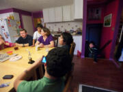 The Anders family (from left around the table): Shelby, 12; dad Forest; Uriel, 10; mom Trina; Rene, 12; Deven, 12.