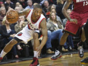 Portland's Damian Lillard commands the court as the Trail Blazers take on the Heat in the first half at the Rose Garden.