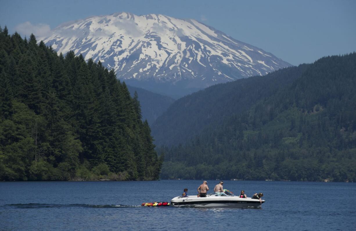 Families enjoy a day of swimming, boating and some juicy watermelon July 6 at Saddle Dam, which is one of the area's best picnic locations.