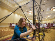 Columbia Credit Union's Michelle Thor sets up the company's information booth.