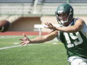 Evergreen High School linebacker Brody Bagnall participates in a drill at McKenzie Stadium, Wednesday.