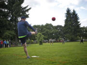 A Hough Shamrocks team member boots the ball against the Carter Park Kickers at an adult kickball league match at John Ball Park.