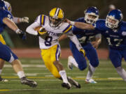 Columbia River's Terrell Bolton, #8, carries the ball against Mountain View on Friday.