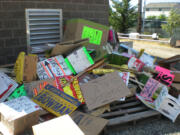 Signs pile up outside after a sweep of placards placed illegally in the public right-of-way.