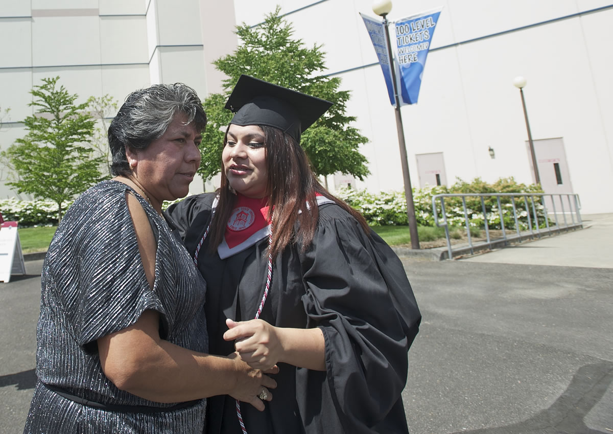 WSUV graduate Monica Santos-Pinacho gets a hug from her mother, Aquilina Pinacho, outside the Sleep Country Amphitheater.