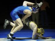 Ben Dixon of Mountain View High School takes down Tyler Hovis of Hudson's Bay during the 113 pound match Wednesday January 9, 2012 in Vancouver, Washington. Dixon pinned Hovis later in the match.