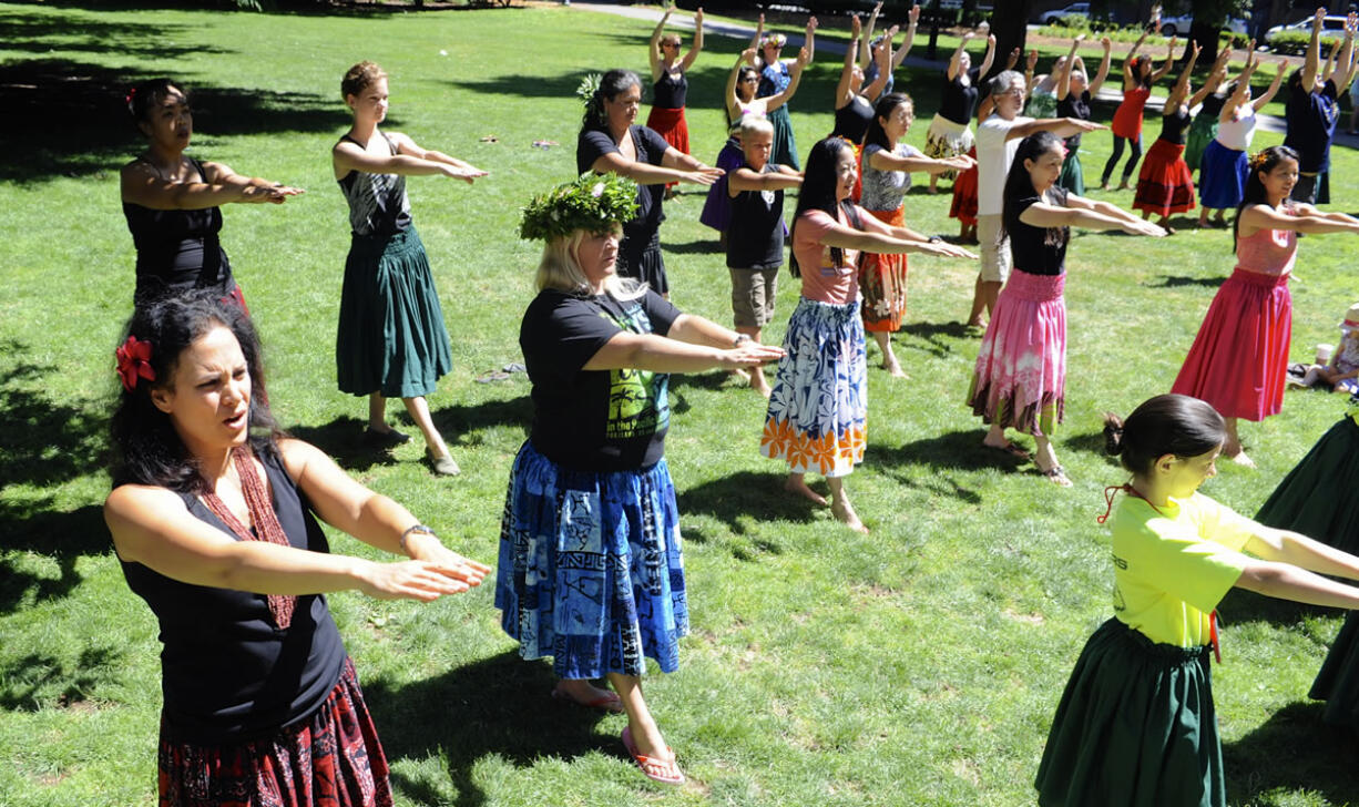 A group practices hula dancing Saturday at the Ho'ike and Hawaiian Festival on Saturday at Esther Short Park.