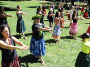 A group practices hula dancing Saturday at the Ho'ike and Hawaiian Festival on Saturday at Esther Short Park.