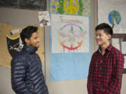 Navraj LamiChhane of Nepal, left, chats with Skyview High School senior Richard Lu on Tuesday in Beverly Questad's classroom. LamiChhane and Lu, who met face-to-face for the first time Tuesday, had worked together to get tents to Nepalese refugees left homeless by the April 25 earthquake. LamiChhane arrived from Nepal on Monday on a five-year student visa. He begins classes at Washington State University Vancouver in January.