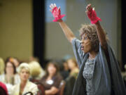 Wambui Bahati delivers a performance of her one-woman show, &quot;I Am Domestic Violence,&quot; at a YWCA fundraising luncheon in downtown Vancouver on Wednesday.