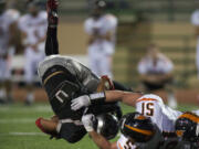 Union's Brendin Quinn is taken down by Battle Ground's Forrest Mays in the second half at McKenzie Stadium on Friday.