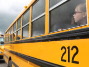 Gracie Stenlund, a student at Hockinson Intermediate School, waits to depart after school on Thursday. Enrollment in the Hockinson School District has declined since the housing market crashed, which means it receives less state funding. The district staggered school schedules to cut the number of bus runs to save $250,000.