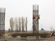 Construction crews work on rebar cages for bridge supports as part of the Salmon Creek Interchange Project.