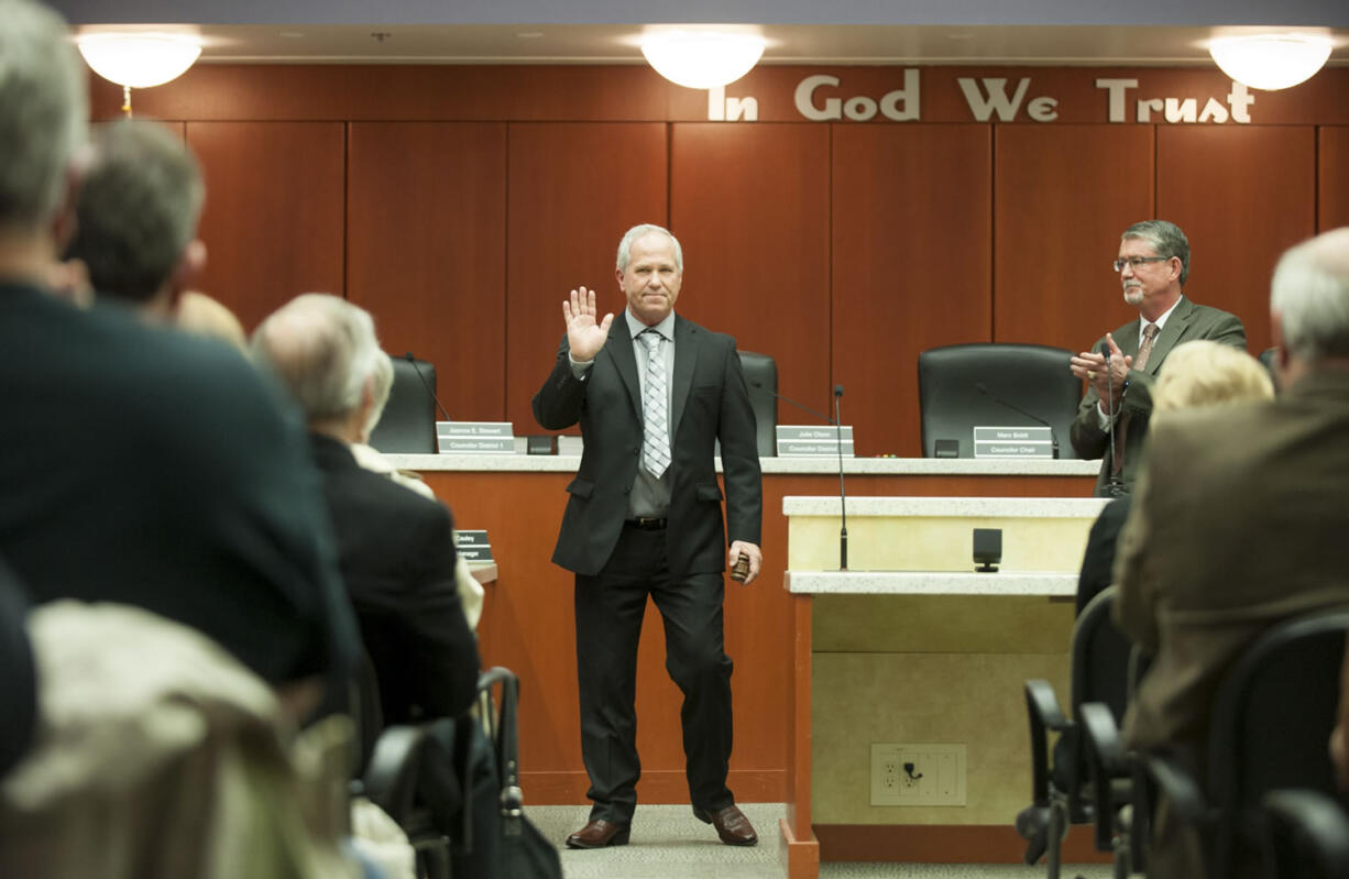 Marc Boldt waves to the audience after he was sworn in as the new chair of the Clark County council in Vancouver on Tuesday.