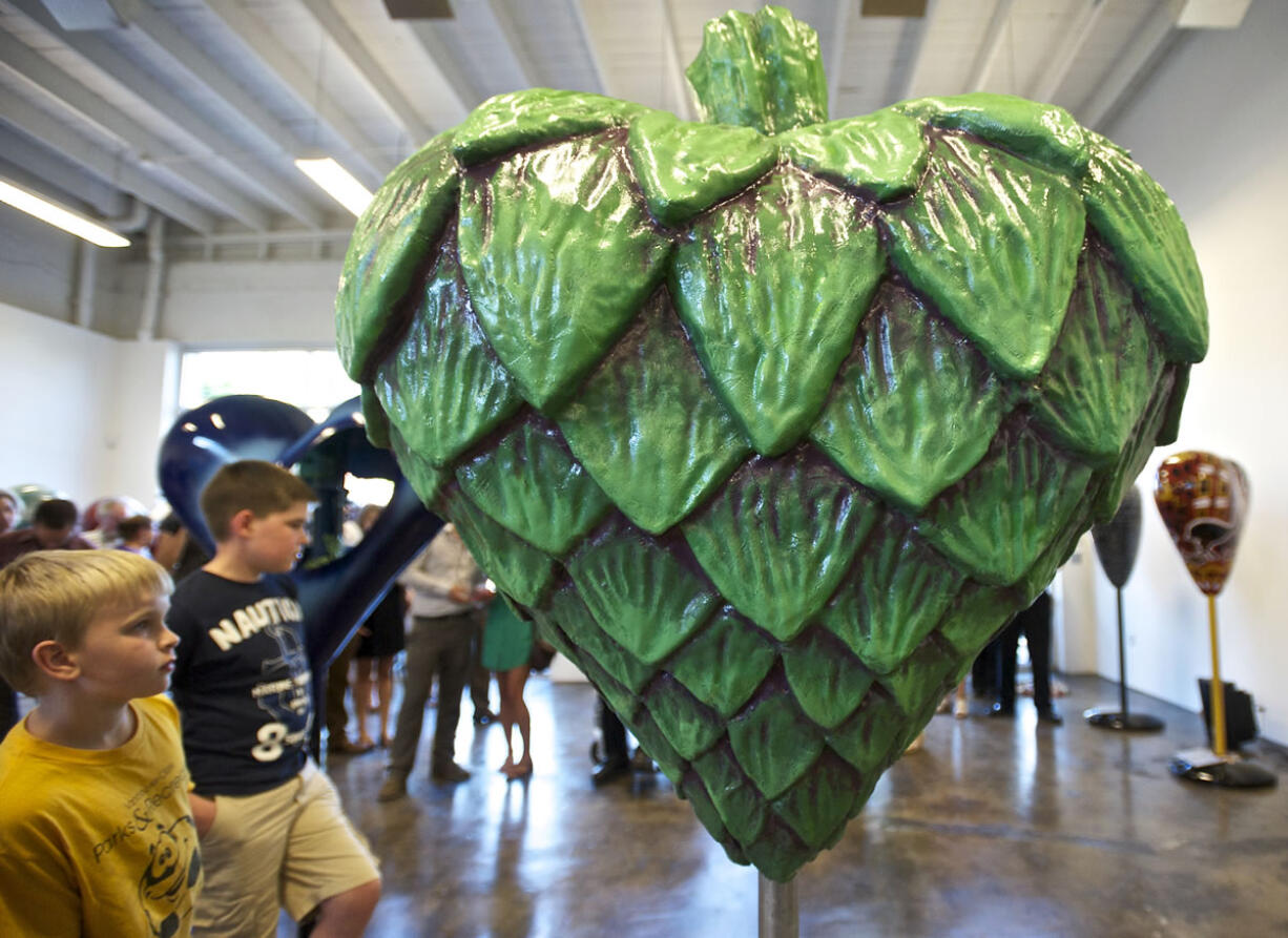 Finn Andrade, 9, looks at the &quot;Heartichoke&quot; at an artist reception last week in Vancouver.