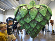 Finn Andrade, 9, looks at the &quot;Heartichoke&quot; at an artist reception last week in Vancouver.