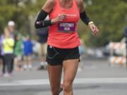 Brittney Forster, 39, of Beaverton, Ore.,, wins the 7th annual Girlfriends Half Marathon on a chilly Sunday morning. Proceeds from the 13.1 mile run will benefit Susan G.