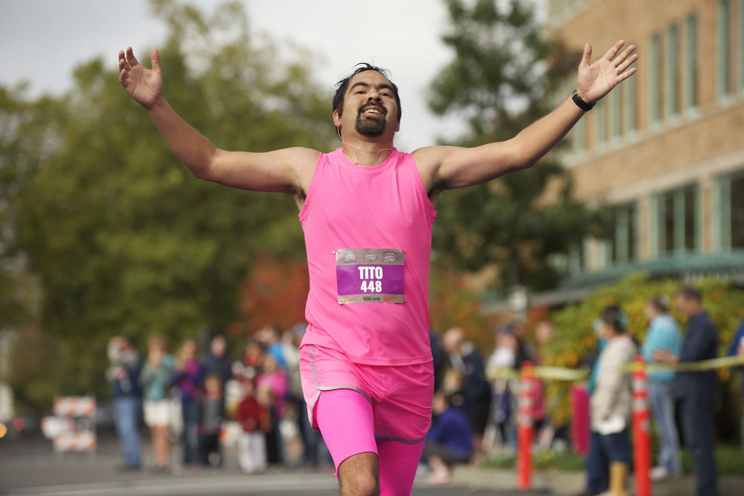 Tito Flores Missoula, Mont., finishes the seventh annual Girlfriends Half Marathon on Sunday, running in memory of his Grandma Grinage.