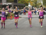 A quartet of happy runners approaches the finish line Sunday morning in the seventh Girlfriends Half Marathon in downtown Vancouver. An estimated 1,800 women competed in the 13.1-mile race that benefitted Susan G.