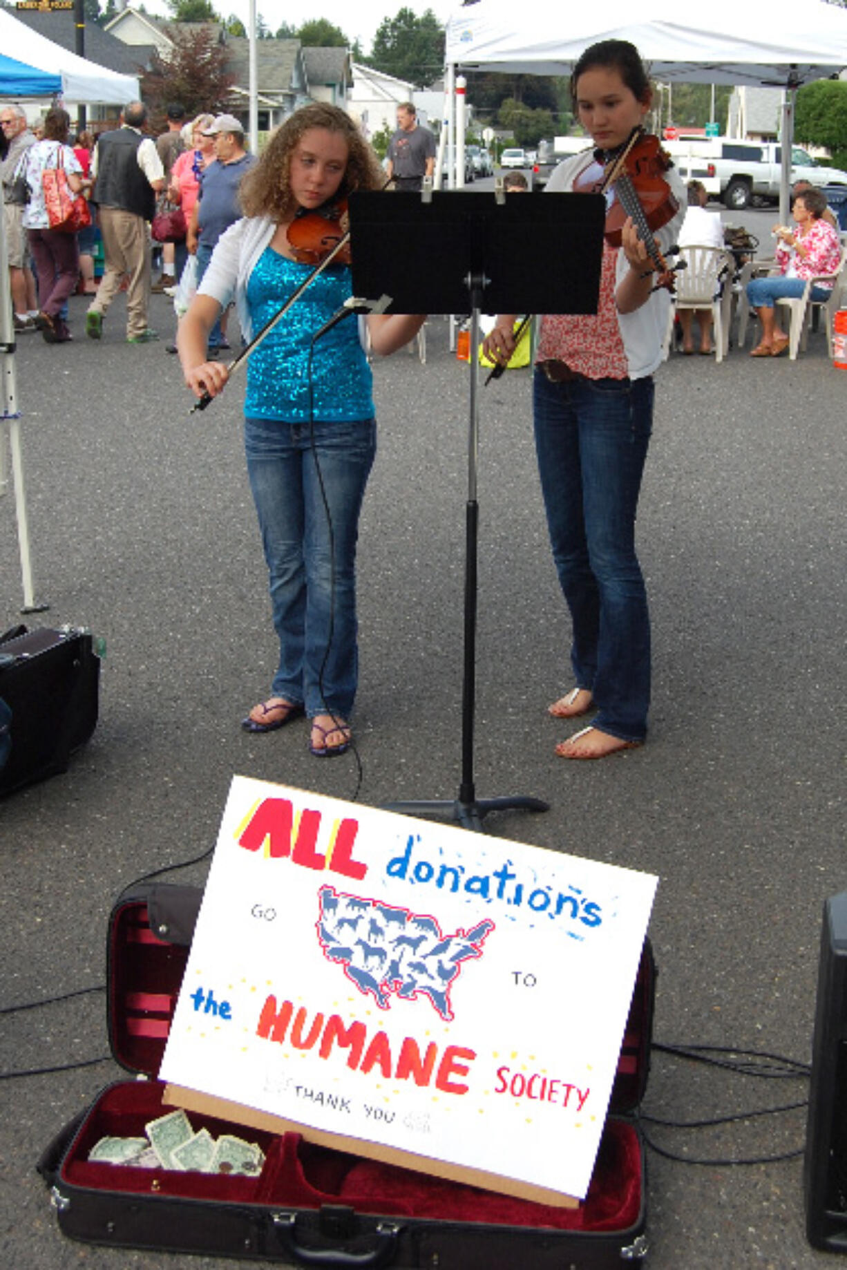 Camas: Sophia Hansen, left, 11, and Rachel Greene, 15, fiddled up a storm on behalf of the West Columbia Gorge Humane Society.