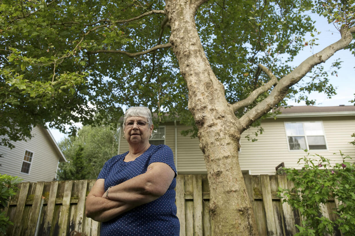 Anne Bonney wants the London planes that surround Indian Hills Condominiums removed because they inflame her allergies.