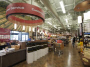 Employees work Tuesday in preparation for Total Wine and More's grand opening Thursday.