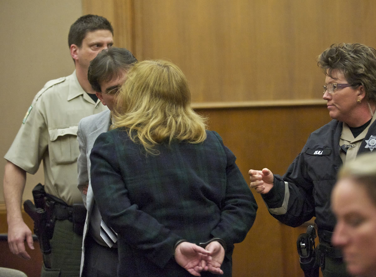 Jeffrey and Sandra Weller kiss each other before they are taken in to custody after the jury returned with multiple guilty verdicts related to imprisoning, starving and beating their adopted twins.