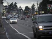 Motorists don't always obey flashing yellow lights, which are used at the crosswalks along this busy strip of Fourth Plain to signal to motorists that a pedestrian might be crossing the street.