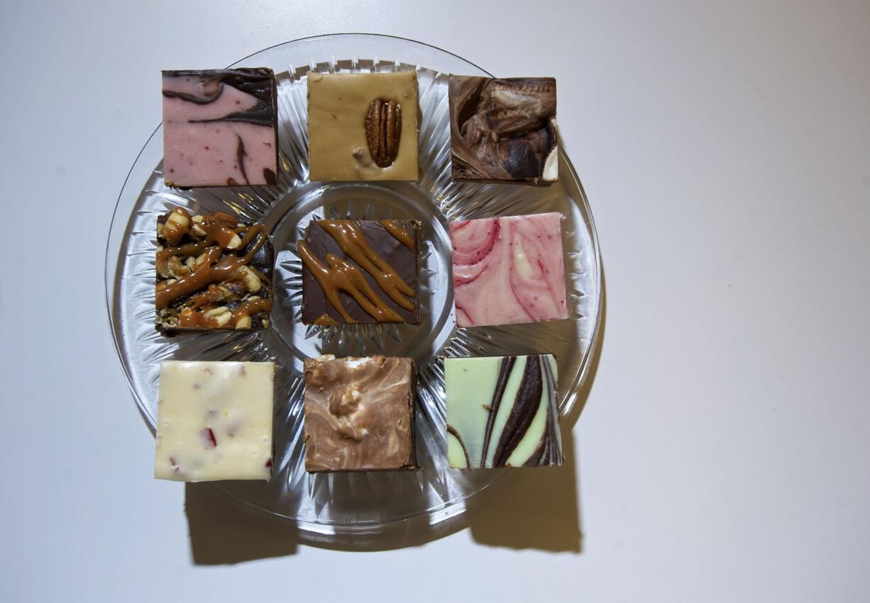 Fudge varieties, top row, from left, dark chocolate raspberry swirl, penuchi pecan, and hot chocolate; nuts 4 you, chocolate oodles and raspberry cream; cranberry orange almond, milk carmelo and dark chocolate mint at Fudge Fix at Daisy Maiz.