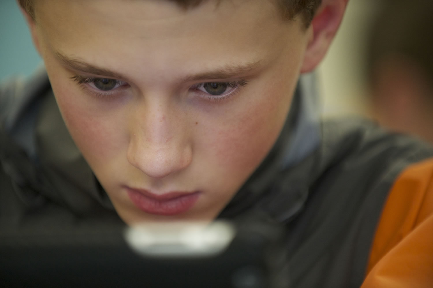 Camron Rowen, 12, a student in Mike Holland's math class at La Center Middle School, starts work on math problems on his iPad.