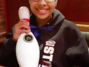 Skyview junior Madison Crockett shows off her championship medal and ceremonial pin from the state bowling meet.