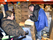 Ridgefield: Joshuah Weygandt, left, and Christopher Smith, juniors in Ridgefield School District's Life Skills Program, receive on-the-job training and high school credit at Tony's Fine Foods warehouse in Ridgefield.