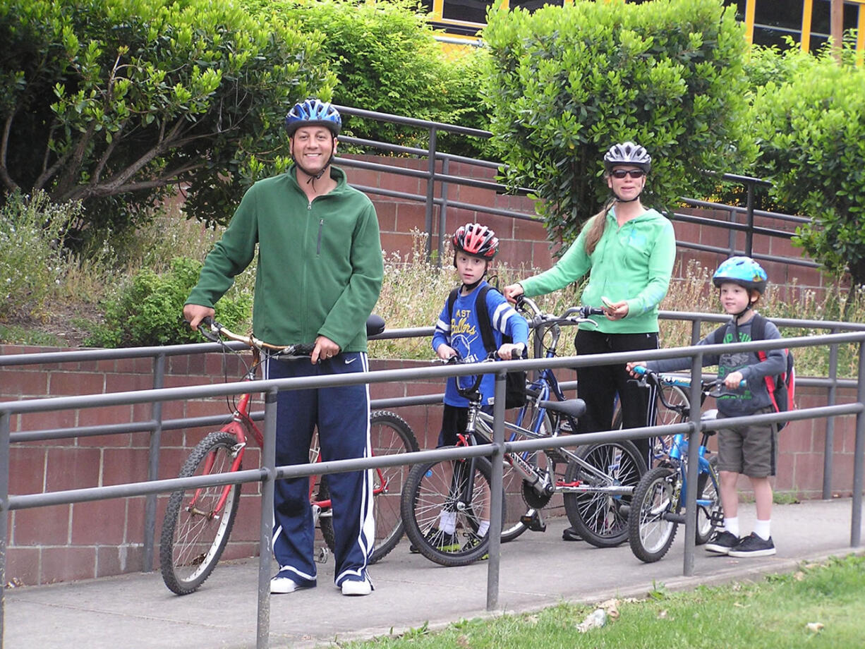 Hazel Dell: The Casana family, Jeff, from left, Andrew, Lori and Carson, join others from Anderson Elementary School during one of a handful of local Bike to School Day events held on May 8.