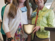 Image: Image Elementary fifth-grader Payton Zitterkopf holds her AAA School Safety Patrol Hall of Fame award on May 24 next to Janet Ray, an assistant vice president for AAA Washington.