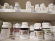 Pain medication prescriptions wait to be picked up by patients at the PeaceHealth Southwest Medical Center pharmacy.