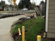 A car sped through the roundabout at N.E. 32nd Circle on Thursday night and damaged a concrete-moored metal post and fence at the home of Jerry Sutherland.