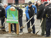 Woodland Police Chief Rob Stephenson, third from right, with other officers, breaks ground for a $2 million police station.