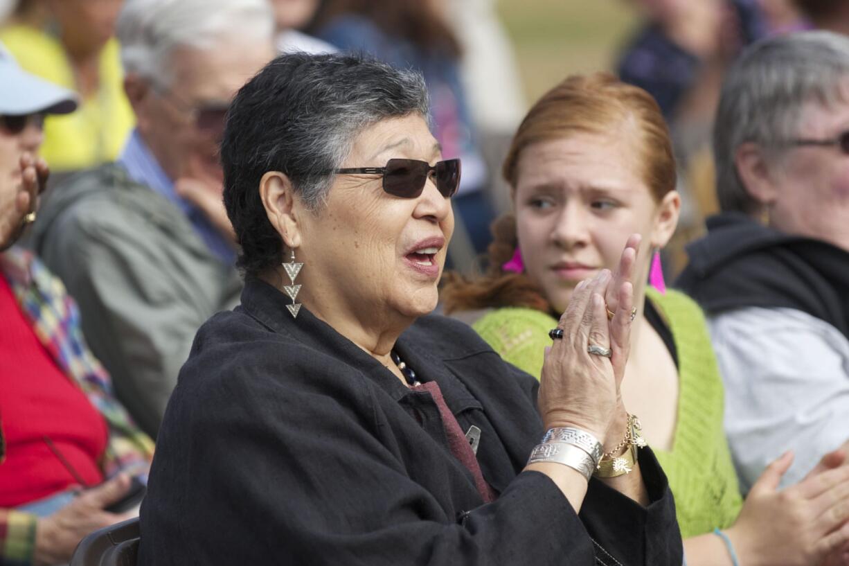 American Indian artist Lillian Pitt designed the Land Bridge welcome gate and other site artwork. &quot;Let the welcome gate take you through to the village,&quot; Pitt told those who attended the celebration.