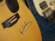 Local muscian Dave Raynor has an autograph of Paul McCartney on one of his guitars.