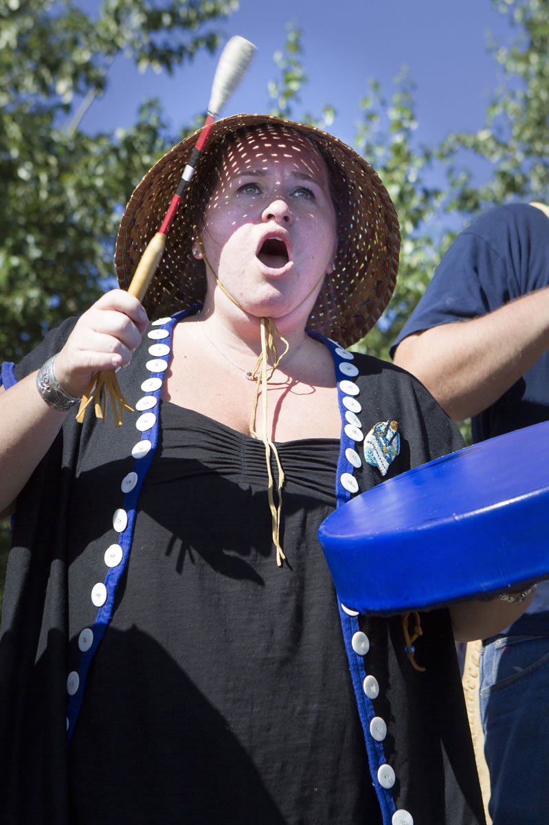 Cassandra Sellards Reck of the Cowlitz Tribe drums a welcome to Cowlitz, Snohomish, Warm Springs and Clatsop-Nehalem pullers, as paddlers are called.