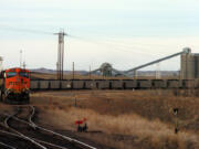 Associated Press files
A coal train idles in front of the Decker Coal Mine near the Wyoming border in Decker, Mont.