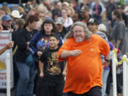 Walter Lewis, from Vancouver, was proud to be the first in line for the free pancake breakfast at the 2013 Clark County Fair on Friday. Being among the first in line is a tradition Lewis shared with his father for many years.